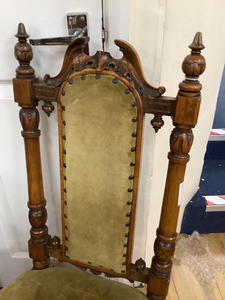 A Victorian nursing chair and an Edwardian book table